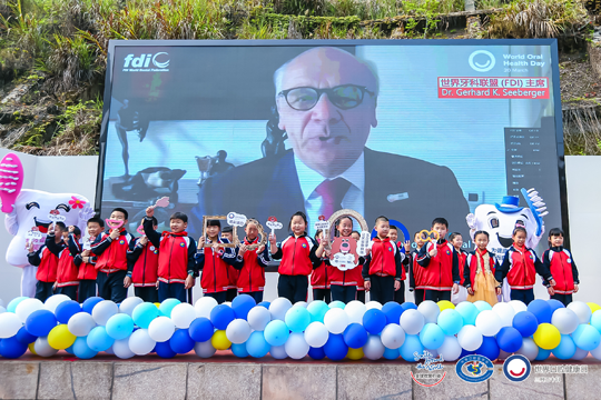 Dr Gerhard K. Seeberger addresses the audience at the 2021 Smile Around the World launch in China. GS WOHD